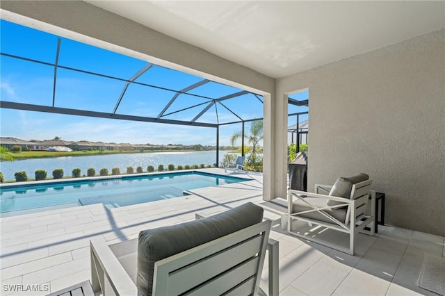 view of pool with glass enclosure, a water view, and a patio