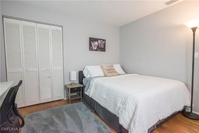 bedroom with a closet and wood-type flooring