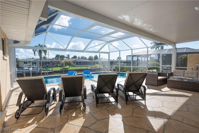 view of patio / terrace with outdoor lounge area and glass enclosure