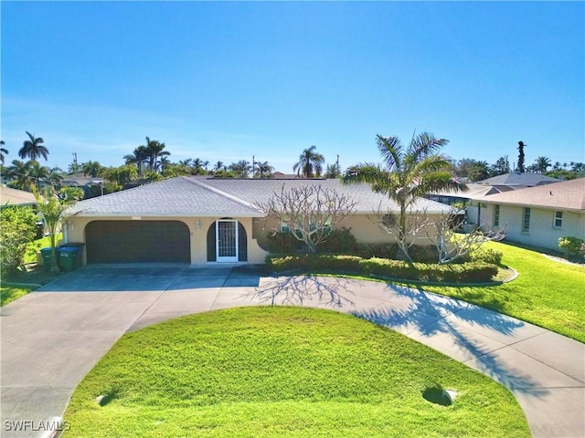 ranch-style house featuring a front yard and a garage