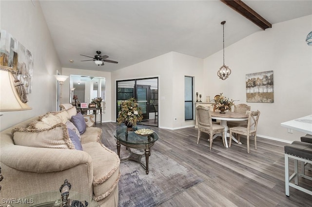 living room featuring hardwood / wood-style floors, lofted ceiling with beams, and ceiling fan