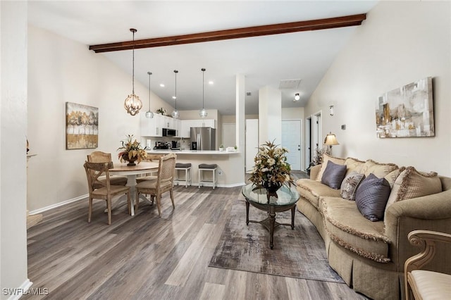 living room with hardwood / wood-style floors, beamed ceiling, and high vaulted ceiling