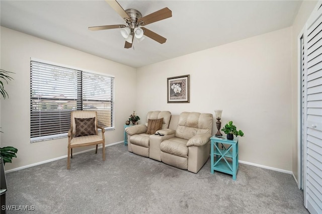 living room with carpet and ceiling fan