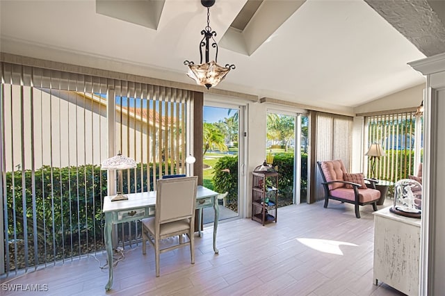 sunroom / solarium with vaulted ceiling