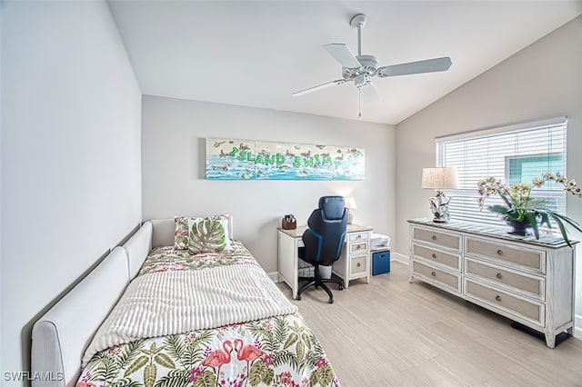 bedroom with ceiling fan, lofted ceiling, and light hardwood / wood-style flooring