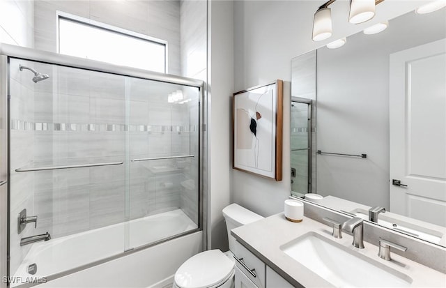 1845 Verada Ct, Naples, FL 34120 - full bathroom with vanity, toilet, and bath / shower combo with glass door