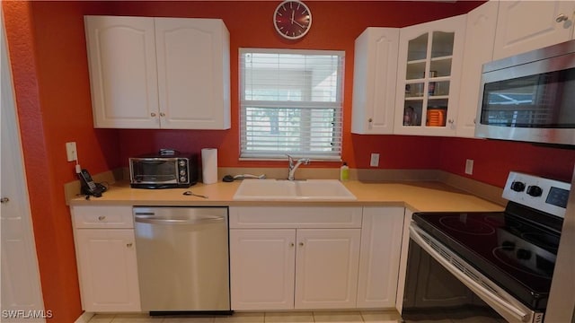 kitchen with white cabinets, sink, and stainless steel appliances