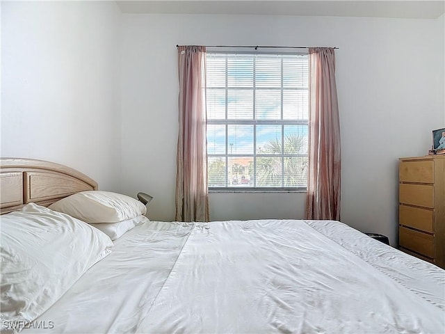 bedroom featuring multiple windows