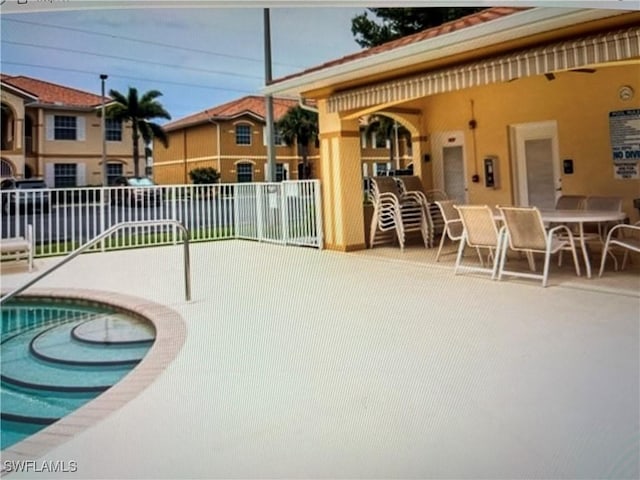 view of swimming pool with a patio area