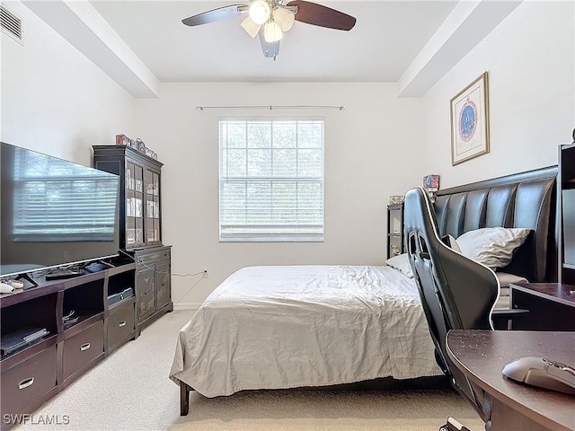 bedroom featuring ceiling fan and light carpet