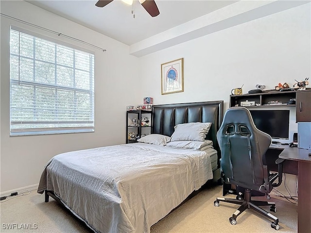 bedroom with light carpet and ceiling fan