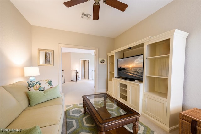 living room featuring light colored carpet and ceiling fan