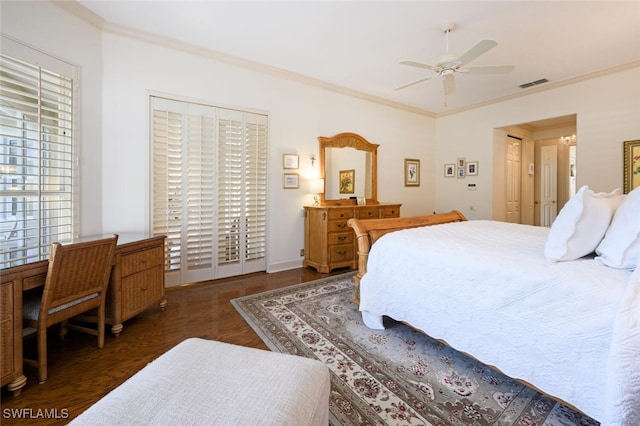 bedroom with ceiling fan, dark hardwood / wood-style flooring, and ornamental molding