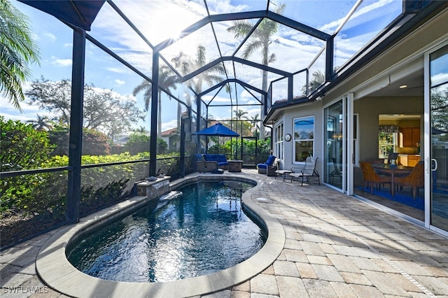 view of pool featuring a lanai and a patio area