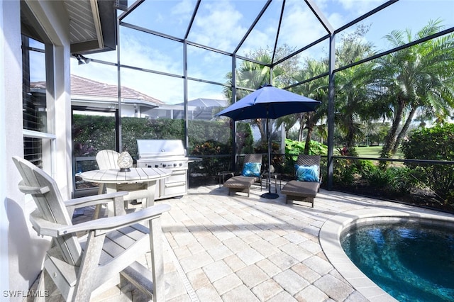 view of patio / terrace with glass enclosure and area for grilling