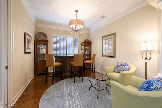 interior space featuring dark hardwood / wood-style flooring, bar, ornamental molding, and a notable chandelier