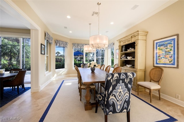 dining room with crown molding, light tile patterned floors, and a chandelier