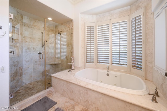 bathroom featuring shower with separate bathtub