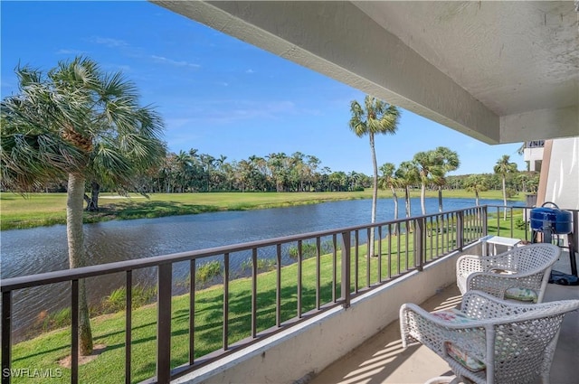 balcony featuring a water view