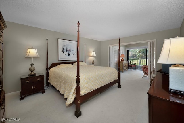 carpeted bedroom featuring access to outside