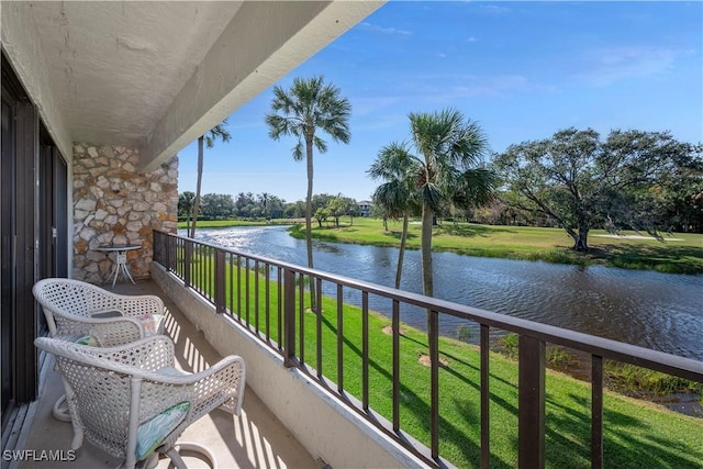 balcony featuring a water view