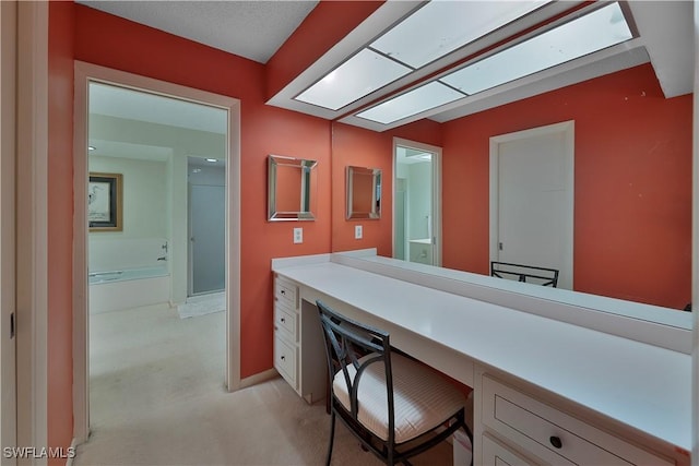 bathroom featuring a washtub and vanity