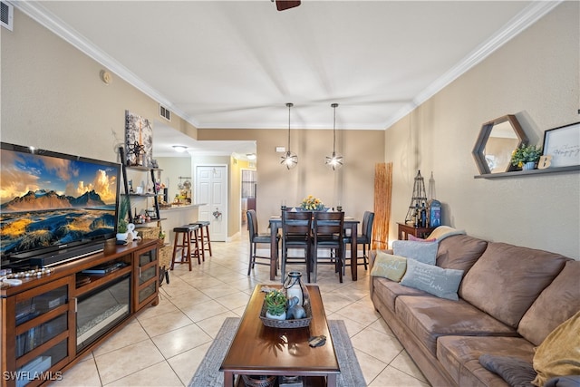 living room with light tile patterned floors and crown molding