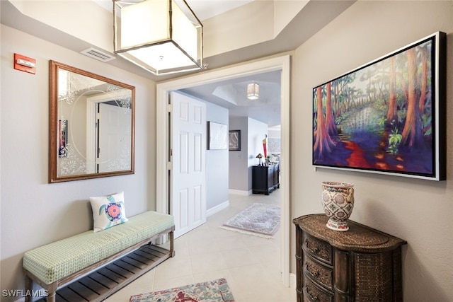 hallway featuring light tile patterned flooring