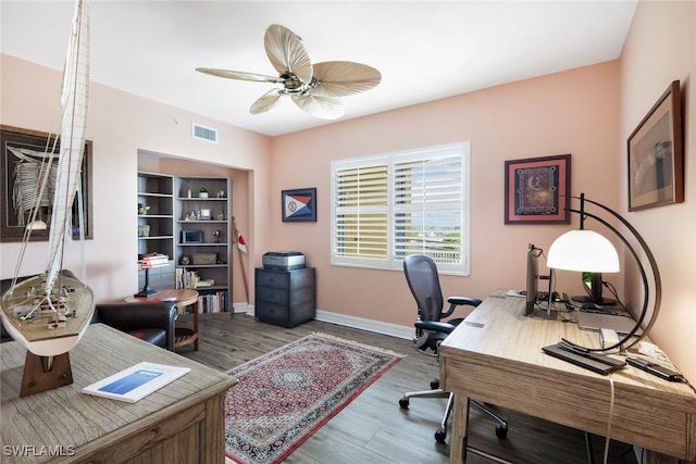 home office with hardwood / wood-style flooring and ceiling fan