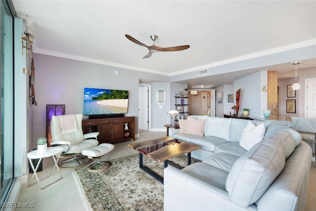 living room featuring ceiling fan, light tile patterned flooring, and ornamental molding