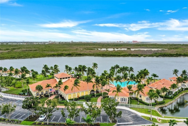 birds eye view of property with a water view