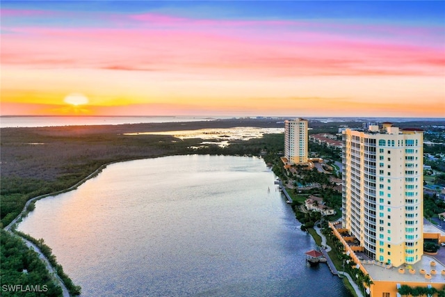 aerial view at dusk with a water view