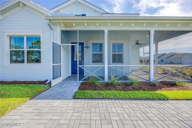 entrance to property with ceiling fan