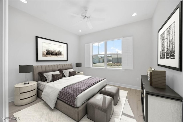 bedroom with light hardwood / wood-style flooring and ceiling fan