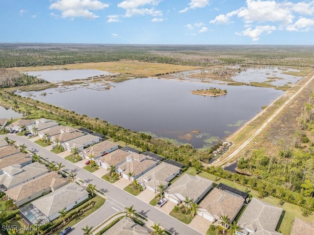 bird's eye view with a water view