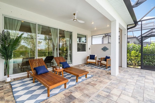 sunroom with ceiling fan