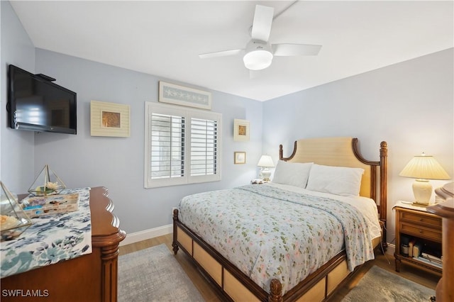 bedroom featuring hardwood / wood-style flooring and ceiling fan