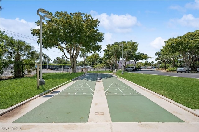 view of home's community featuring a lawn