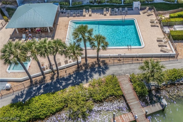 birds eye view of property with a water view