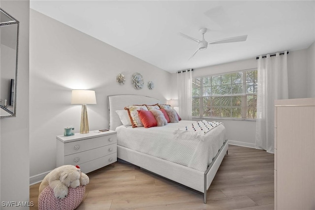 bedroom with ceiling fan and light hardwood / wood-style flooring