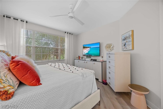 bedroom featuring ceiling fan and light hardwood / wood-style flooring