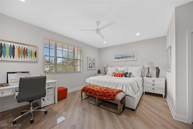 bedroom with ceiling fan and light hardwood / wood-style floors