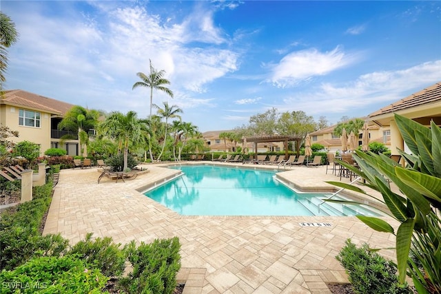 view of swimming pool with a pergola and a patio area