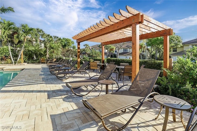 view of patio / terrace featuring a pergola and a community pool