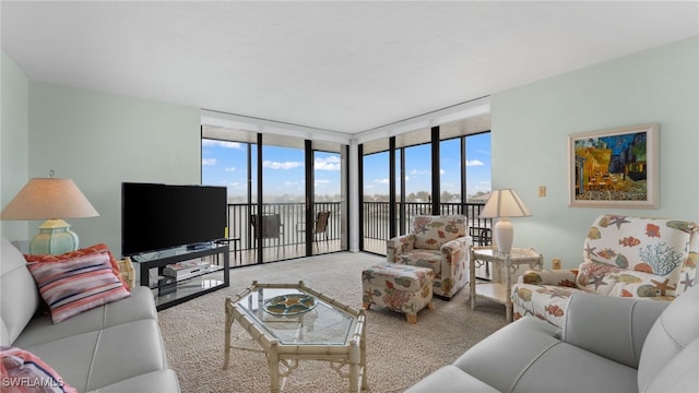 living room featuring expansive windows, plenty of natural light, and carpet floors