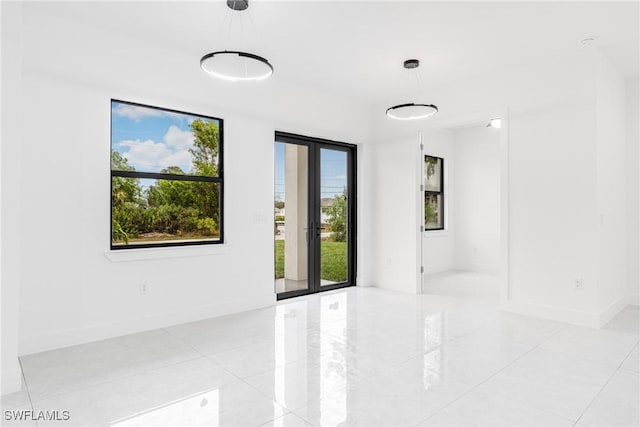 spare room featuring french doors