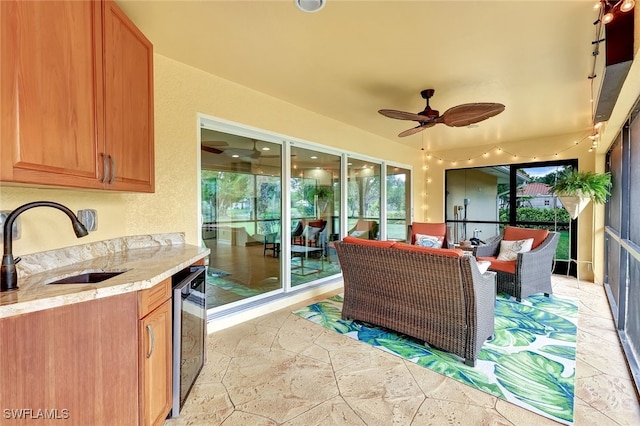 exterior space featuring ceiling fan and sink