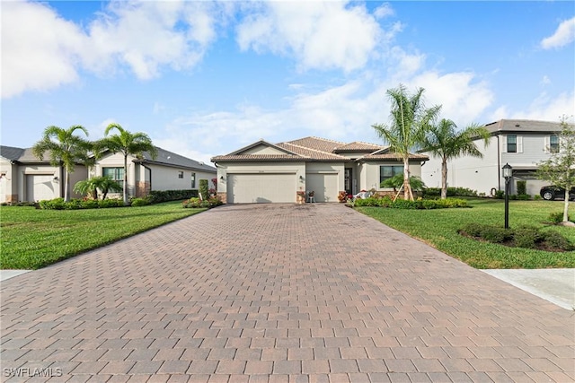 view of front of house with a garage and a front yard