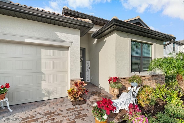 property entrance with a garage