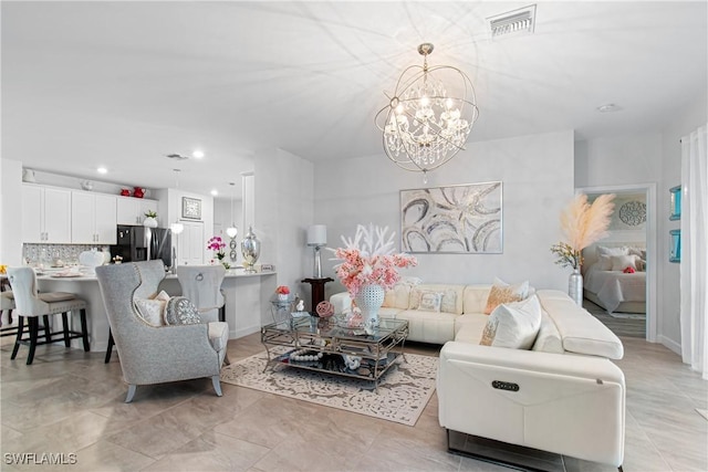 living room with a notable chandelier